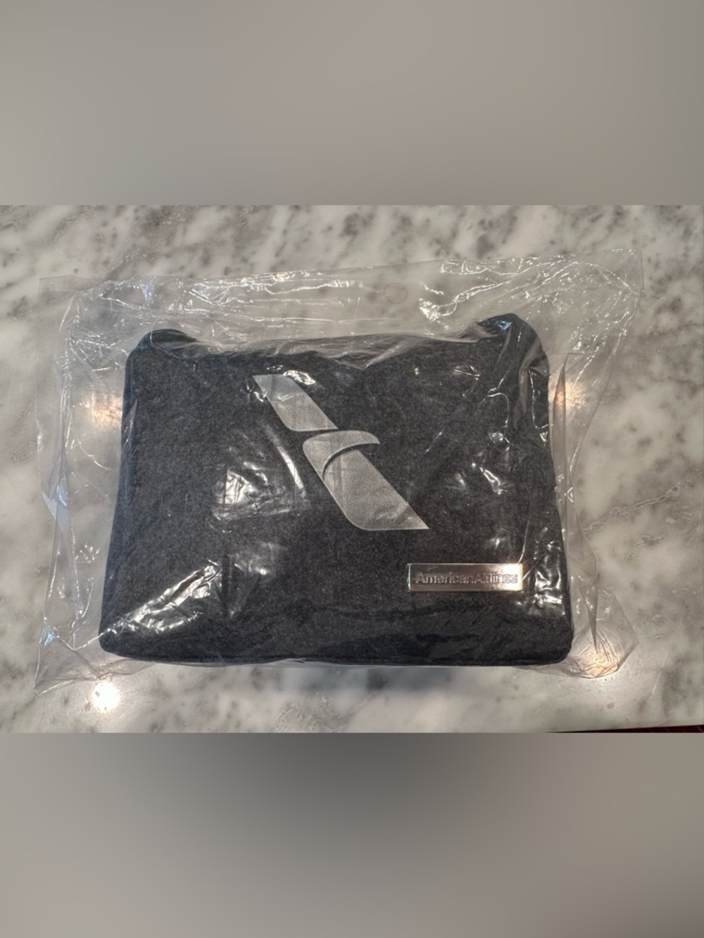 American Airlines First Class Amenity Kit with red zipper